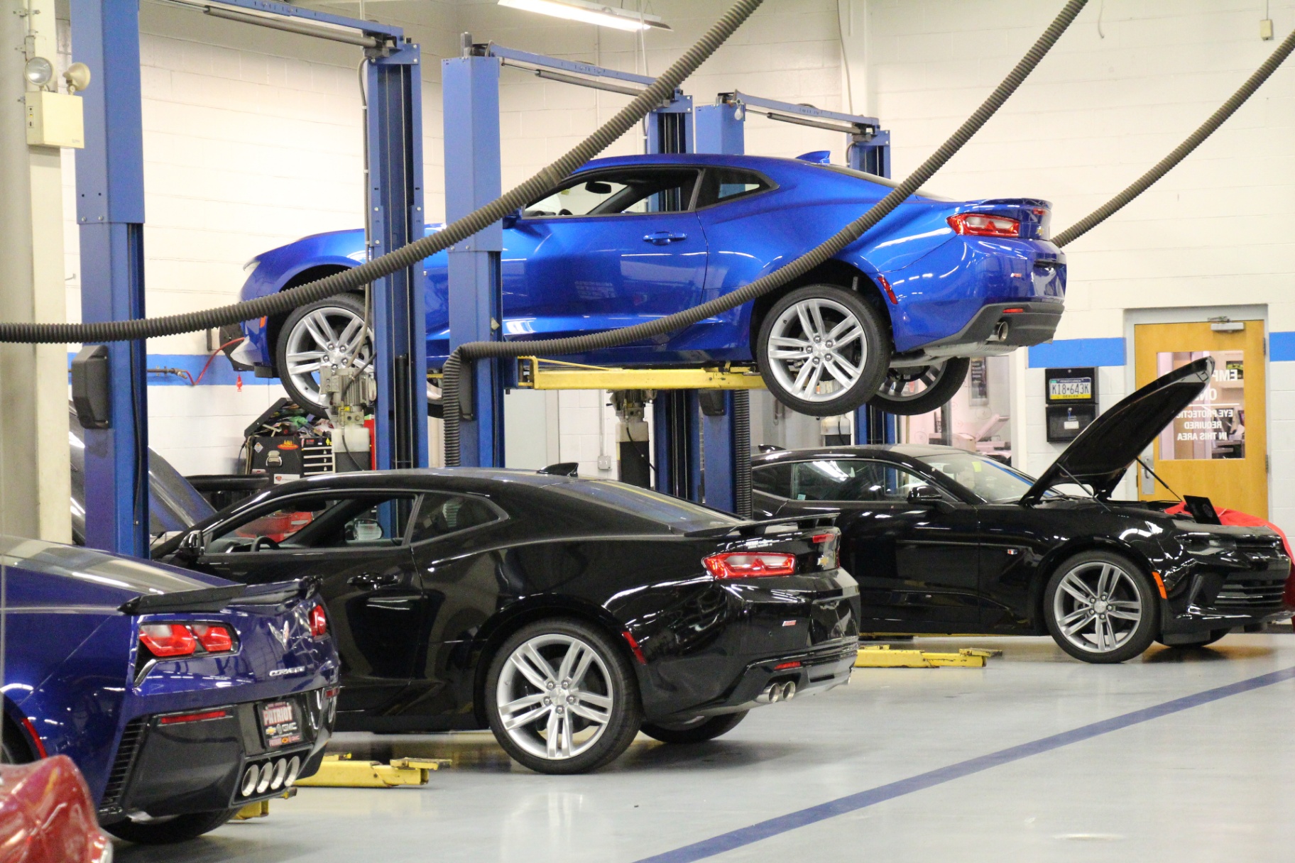 Multiple Camaros staged across Patriot service bays